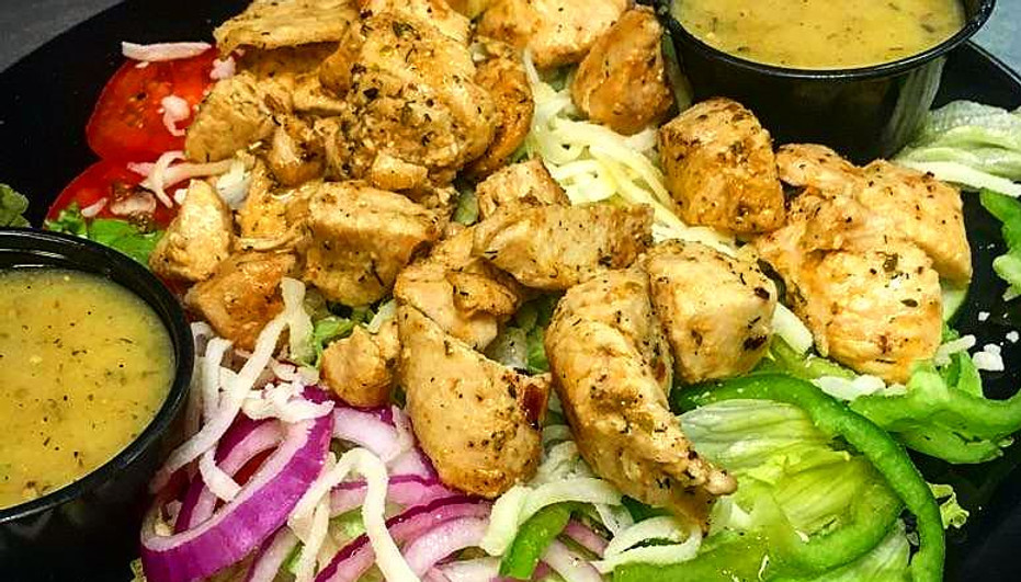 Golden chicken parmesan over pasta with rich marinara sauce