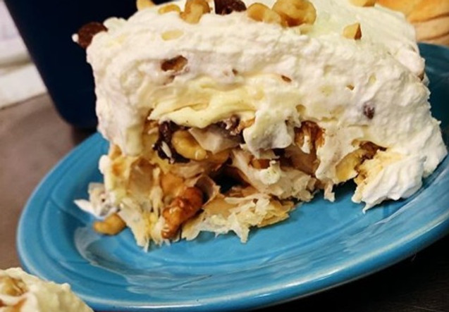 Close-up shot of a freshly prepared Holiday Pizza dish with vibrant colors and fresh ingredients