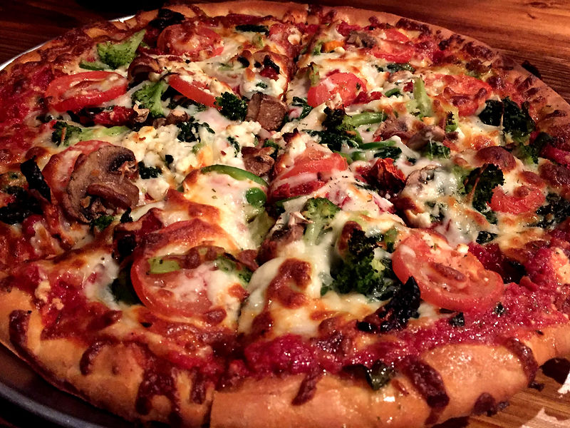 Plated entree showcasing Holiday Pizza's Italian kitchen craftsmanship